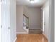 Inviting foyer with hardwood floors and a staircase leading to the upper level at 3152 Parks Run, Loganville, GA 30052