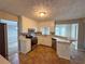 Spacious kitchen featuring tiled flooring, stainless appliances, and bright countertops at 3152 Parks Run, Loganville, GA 30052