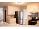 Updated kitchen with white cabinets, stainless steel appliances, and modern countertops at 3152 Parks Run, Loganville, GA 30052