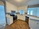 Modern kitchen with updated appliances, countertops, and tiled floor at 3152 Parks Run, Loganville, GA 30052