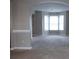 Neutral living room with large bay windows at 3152 Parks Run, Loganville, GA 30052