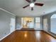 Open floor plan with hardwood floors leading to kitchen and dining at 3152 Parks Run, Loganville, GA 30052