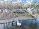 Aerial view of a home near a lake, surrounded by trees, showcasing its serene location at 4258 Rocky Ledge Way, Snellville, GA 30039