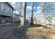 Spacious backyard with a partial view of the lake and mature trees, perfect for outdoor activities at 4258 Rocky Ledge Way, Snellville, GA 30039