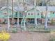 Wide view of a large backyard featuring a deck area, hot tub, mature trees, and partial fence, ideal for outdoor enjoyment at 4258 Rocky Ledge Way, Snellville, GA 30039