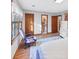 Bright bedroom with natural light, laminate wood flooring, and white trim at 4258 Rocky Ledge Way, Snellville, GA 30039