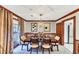 Traditional dining room with wooden table and chairs, elegant lighting, and stylish decor at 4258 Rocky Ledge Way, Snellville, GA 30039
