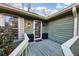 Charming front porch with stylish planters and a decorative wreath on the front door at 4258 Rocky Ledge Way, Snellville, GA 30039