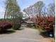 Charming single-story home with a well-manicured front yard and a long, winding driveway at 4258 Rocky Ledge Way, Snellville, GA 30039