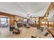Inviting living room featuring a brick fireplace, wood paneling, and comfortable seating at 4258 Rocky Ledge Way, Snellville, GA 30039