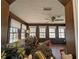 Sun room with multiple windows offering plenty of light, wood paneling, and textured ceilings at 4258 Rocky Ledge Way, Snellville, GA 30039