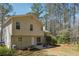 Inviting backyard featuring a patio with a picnic table and string lights, perfect for outdoor entertaining at 656 New Hope Rd, Lawrenceville, GA 30046