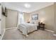 Cozy bedroom with neutral walls, carpet flooring, and natural light at 656 New Hope Rd, Lawrenceville, GA 30046