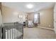 A clean Bedroom with a crib and a window at 656 New Hope Rd, Lawrenceville, GA 30046
