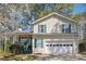 Inviting two-story home with a two car garage and a charming covered porch, perfect for a Gathering at 656 New Hope Rd, Lawrenceville, GA 30046