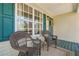 Cozy front porch with seating, offering a relaxing outdoor space to enjoy the neighborhood views at 656 New Hope Rd, Lawrenceville, GA 30046