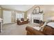 Cozy living room with a fireplace and ample natural light, perfect for relaxing or entertaining guests at 656 New Hope Rd, Lawrenceville, GA 30046