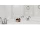 Clean bathroom featuring double sinks, stone countertop, and modern faucets at 100 Westchester Pass, Peachtree City, GA 30269