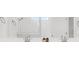 Bright bathroom featuring double sinks, stone countertop, and modern faucets at 100 Westchester Pass, Peachtree City, GA 30269