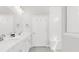 Bright bathroom featuring double vanity, large mirror, and tiled shower with built-in bench at 100 Westchester Pass, Peachtree City, GA 30269