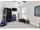 Versatile bedroom space with an elliptical machine, perfect for a home gym at 100 Westchester Pass, Peachtree City, GA 30269