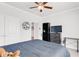 Comfortable bedroom with a ceiling fan, blue bedding, and neutral-toned walls and carpet at 100 Westchester Pass, Peachtree City, GA 30269