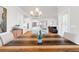 Elegant dining area with stylish light fixture open to kitchen and living spaces at 100 Westchester Pass, Peachtree City, GA 30269