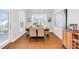 Bright dining room with hardwood floors and a view of the backyard at 100 Westchester Pass, Peachtree City, GA 30269