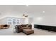 Cozy living area featuring a comfortable sofa, desk, and stylish cabinets at 100 Westchester Pass, Peachtree City, GA 30269