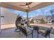 Outdoor patio features ample seating and a ceiling fan for warm days at 100 Westchester Pass, Peachtree City, GA 30269
