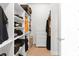 Organized walk-in closet with built-in shelving and drawers, perfect for storage at 100 Westchester Pass, Peachtree City, GA 30269