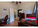 This bedroom features a twin bed, wood floors, and a closet at 4985 Union St, Union City, GA 30291