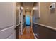 Hallway with hardwood floors and neutral paint, and doors leading to bedrooms at 4985 Union St, Union City, GA 30291