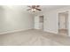 Large bedroom features neutral paint, soft carpet and two entryways at 507 Grove Field Ct, Suwanee, GA 30024