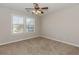 Bedroom with neutral paint, lots of natural light and soft carpet at 507 Grove Field Ct, Suwanee, GA 30024