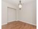 Cozy dining room with hardwood floors and chandelier lighting at 507 Grove Field Ct, Suwanee, GA 30024