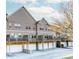 Townhome building featuring garages, decks, and neutral-colored siding at 507 Grove Field Ct, Suwanee, GA 30024
