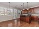Spacious kitchen with an island, stainless appliances and door to exterior patio at 507 Grove Field Ct, Suwanee, GA 30024