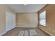 Bedroom featuring neutral walls, plush carpeting, closet and natural light from a window at 6599 Coventry Pt, Austell, GA 30168