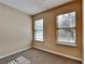 Bedroom featuring neutral walls, plush carpeting, and two windows providing natural light at 6599 Coventry Pt, Austell, GA 30168