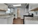 Modern kitchen featuring granite countertops, white cabinetry, and stainless steel appliances at 6599 Coventry Pt, Austell, GA 30168