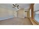 Spacious primary bedroom featuring carpet flooring, natural light, and access to the bathroom at 6599 Coventry Pt, Austell, GA 30168