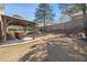 Backyard with patio and pergola featuring comfortable seating and manicured landscaping on a sunny day at 1993 Shenley Park Ln, Duluth, GA 30097
