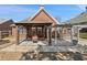Backyard patio with a pergola offering an outdoor dining and relaxing space at 1993 Shenley Park Ln, Duluth, GA 30097