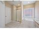 This bathroom has a walk-in shower, a soaking tub, and granite counters for a luxurious experience at 1993 Shenley Park Ln, Duluth, GA 30097