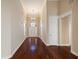 Grand foyer with gleaming hardwood floors, high ceilings, and elegant chandelier at 1993 Shenley Park Ln, Duluth, GA 30097