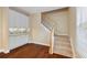 Hallway featuring hardwood floors, staircase and modern fixtures at 1993 Shenley Park Ln, Duluth, GA 30097