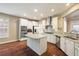 Bright and airy kitchen with stainless steel appliances, large island, and modern cabinetry at 1993 Shenley Park Ln, Duluth, GA 30097