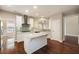 Spacious kitchen boasting a center island, stainless appliances, and hardwood flooring at 1993 Shenley Park Ln, Duluth, GA 30097