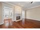 Living room featuring hardwood floors, a fireplace, and views into the other rooms in the house at 1993 Shenley Park Ln, Duluth, GA 30097
